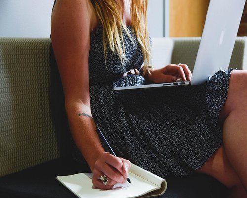 Person stretching lightly while working from home