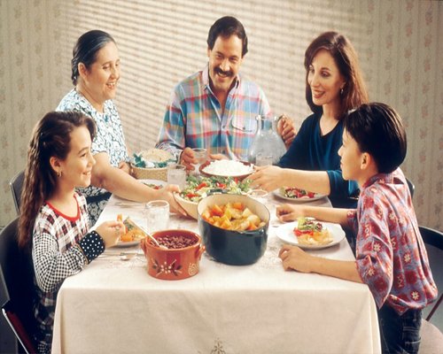 Family dinner with diverse Thai home cooked dishes