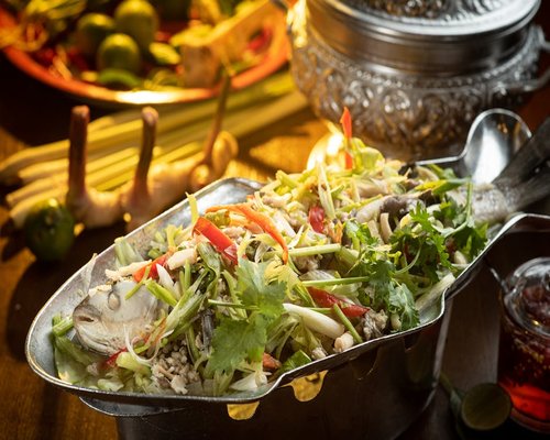 Steamed fish with herbs in a Thai kitchen
